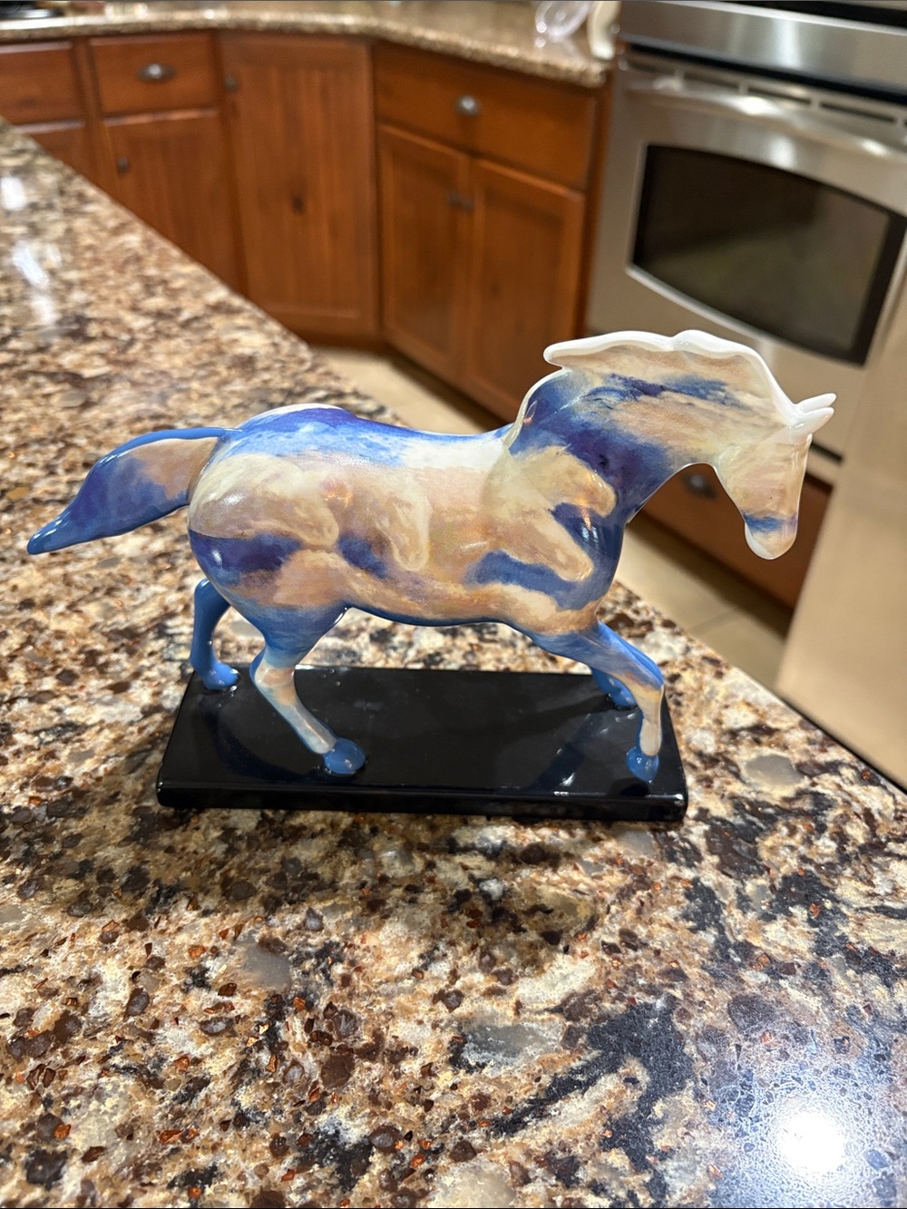 Blue and Cream Ceramic Horse Figurine on Black Base